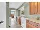 Convenient laundry room with modern appliances and granite countertops at 1357 Brownswood Dr, Brownsburg, IN 46112