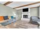 Warm living room with painted fireplace and neutral finishes and tones at 1357 Brownswood Dr, Brownsburg, IN 46112