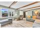 Spacious living room with hardwood floors, exposed beams, and natural light at 1357 Brownswood Dr, Brownsburg, IN 46112