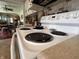 Close-up of a white electric range top with four burners, with a view into the dining room beyond at 1433 N Colorado Ave, Indianapolis, IN 46201