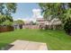 Grassy backyard enclosed by a wood fence with a concrete patio visible at 15388 Dry Creek Rd, Noblesville, IN 46060