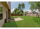 Fenced backyard featuring a lawn, patio, and view of the home's exterior at 15388 Dry Creek Rd, Noblesville, IN 46060