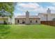 Spacious backyard with lush green grass, fenced perimeter, and view of the home at 15388 Dry Creek Rd, Noblesville, IN 46060