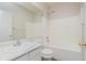 Well-lit bathroom featuring a shower-tub combo and single sink vanity at 15388 Dry Creek Rd, Noblesville, IN 46060