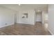 Open-concept living area with hardwood floors flowing into other rooms at 15388 Dry Creek Rd, Noblesville, IN 46060