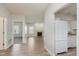 Open-concept living room featuring wood floors, a fireplace, and plenty of natural light at 15388 Dry Creek Rd, Noblesville, IN 46060