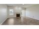 Bright living room with a fireplace, sliding glass doors, and hardwood floors at 15388 Dry Creek Rd, Noblesville, IN 46060