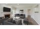 Inviting living room featuring a fireplace, ceiling fan, sliding glass doors and neutral paint at 15388 Dry Creek Rd, Noblesville, IN 46060