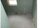 Unfinished bathroom featuring a window for natural light and necessary plumbing installations ready for customization at 1601 Spann Ave, Indianapolis, IN 46203