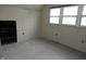 A bedroom area with a window and some electrical boxes at 1601 Spann Ave, Indianapolis, IN 46203