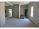 Open-concept living room with new drywall, offering a versatile canvas for your dream home at 1601 Spann Ave, Indianapolis, IN 46203