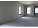 Bright room showcasing drywall, large windows, and natural light, ready to be transformed at 1601 Spann Ave, Indianapolis, IN 46203