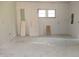 Bright room with drywall and window, offering a versatile space ready for renovation at 1601 Spann Ave, Indianapolis, IN 46203