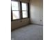 Unfinished room showcasing a window providing natural light and open space, ready for customization and design at 1601 Spann Ave, Indianapolis, IN 46203