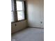 Unfinished room featuring a window for natural light and open space ready for design and customization at 1601 Spann Ave, Indianapolis, IN 46203