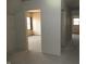 Unfinished room with doorway access and a large window, ready for customization and personalization at 1601 Spann Ave, Indianapolis, IN 46203