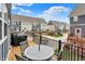 Relax on the deck with a view of the community, beautiful townhomes, and manicured lawns on a bright day at 16057 Coleman Dr, Westfield, IN 46074