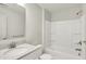 A bathroom features a shower-tub combination with brushed nickel fixtures and a white vanity at 16057 Coleman Dr, Westfield, IN 46074