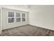 A bedroom featuring carpeted floors, three windows with modern blinds, and white walls at 16057 Coleman Dr, Westfield, IN 46074