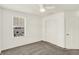 Minimalist bedroom with a ceiling fan, gray carpet, a window with blinds, and a closet with sliding doors at 16057 Coleman Dr, Westfield, IN 46074