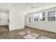Bright bonus room featuring wood floors, abundant natural light, and staircase access at 16057 Coleman Dr, Westfield, IN 46074