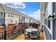 Relaxing deck with outdoor furniture overlooking lush greenery and beautiful townhome community at 16057 Coleman Dr, Westfield, IN 46074