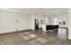 Open floor plan featuring a modern kitchen with an island and a view into the living area at 16057 Coleman Dr, Westfield, IN 46074