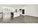 Spacious kitchen featuring white cabinets, stainless appliances, and a stylish island with shelving at 16057 Coleman Dr, Westfield, IN 46074