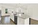 Modern kitchen showcasing white cabinets, stainless steel appliances, and a large island with a sink at 16057 Coleman Dr, Westfield, IN 46074
