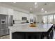 Modern kitchen boasts a large island, stainless steel appliances, pendant lighting, and quartz countertops at 16057 Coleman Dr, Westfield, IN 46074