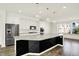 Bright kitchen featuring a spacious island with a white countertop and black decorative trim at 16057 Coleman Dr, Westfield, IN 46074