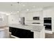 Well-lit kitchen area featuring stainless steel appliances, granite countertops, and a large island at 16057 Coleman Dr, Westfield, IN 46074