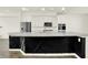Bright kitchen featuring white cabinets, stainless steel appliances, and a black decorative island at 16057 Coleman Dr, Westfield, IN 46074