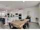 Bright kitchen area with a large wood table and black chairs, adjacent to the modern kitchen at 16057 Coleman Dr, Westfield, IN 46074