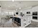 Modern kitchen with granite counters, stainless steel appliances, and a large island with bar seating at 16057 Coleman Dr, Westfield, IN 46074