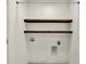 A laundry room featuring a utility sink, connections for a washer and dryer, and open shelving at 16057 Coleman Dr, Westfield, IN 46074