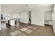 Open-concept living space featuring wood flooring, a modern kitchen, and a staircase at 16057 Coleman Dr, Westfield, IN 46074