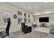 A spacious living area with hardwood floors, modern furniture, and large windows at 16057 Coleman Dr, Westfield, IN 46074