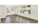 Bright living room featuring hardwood floors, white walls, and large windows with modern blinds at 16057 Coleman Dr, Westfield, IN 46074