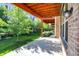 Spacious covered patio with brick exterior, perfect for outdoor enjoyment with ample shade at 16057 Coleman Dr, Westfield, IN 46074