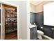 View into half bathroom and walk in pantry off a hallway at 17390 Tribute Row, Noblesville, IN 46060