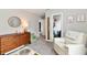 Charming Bedroom with a dresser, chair, and closet; the perfect space to nurture your little one at 17390 Tribute Row, Noblesville, IN 46060