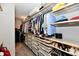 Organized walk-in closet featuring shelving, drawers, and hanging space for clothing at 17390 Tribute Row, Noblesville, IN 46060
