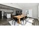Bright dining area with a wooden table, black chairs, and natural light, perfect for Gathering meals at 17390 Tribute Row, Noblesville, IN 46060
