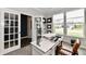 Featuring a bright home office, with large windows for natural light, and glass french doors at 17390 Tribute Row, Noblesville, IN 46060