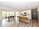 The modern kitchen boasts a large island with breakfast bar, and is open to dining area at 17390 Tribute Row, Noblesville, IN 46060