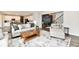 Open living space connecting to a modern kitchen, offering a comfortable and stylish atmosphere at 17390 Tribute Row, Noblesville, IN 46060