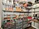 Organized pantry with metal shelving, labeled containers, and baskets for ample storage solutions at 17390 Tribute Row, Noblesville, IN 46060