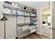 Walk-in pantry with wire shelving providing ample storage for household supplies and essentials at 17390 Tribute Row, Noblesville, IN 46060