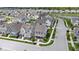 An aerial view showcasing a neighborhood of beautiful two-story homes with manicured lawns, near a serene lake at 1892 Ponsonby Dr, Westfield, IN 46074